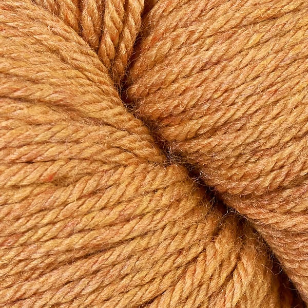 A close up of a skein of Berroco Vintage worsted weight yarn in tan color