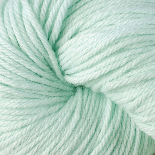 A close up of a skein of Berroco Vintage worsted weight yarn in light pale green color