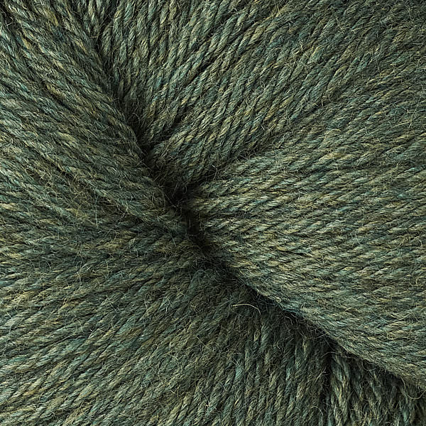 A close up of a skein of Berroco Vintage worsted weight yarn in deep dusty forest green color