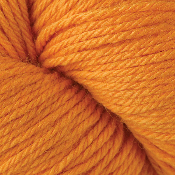 A close up of a skein of Berroco Vintage worsted weight yarn in orange color
