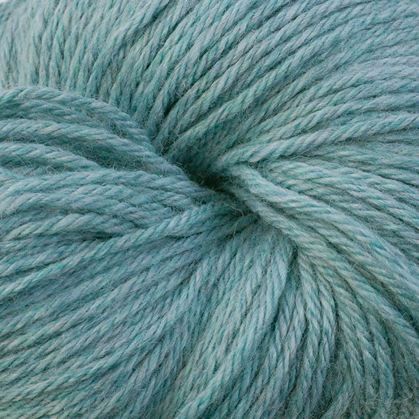 A close up of a skein of Berroco Vintage worsted weight yarn in dusty light blue color