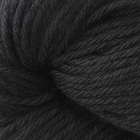 A close up of a skein of Berroco Vintage worsted weight yarn in deep black color