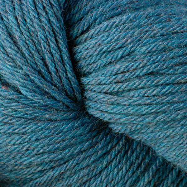A close up of a skein of Berroco Vintage worsted weight yarn in muted blue color