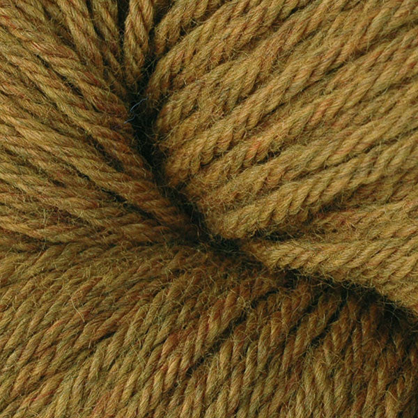 A close up of a skein of Berroco Vintage worsted weight yarn in deep mustard yellow color