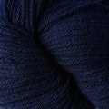 A close up of a skein of Berroco Vintage worsted weight yarn in dark blue color