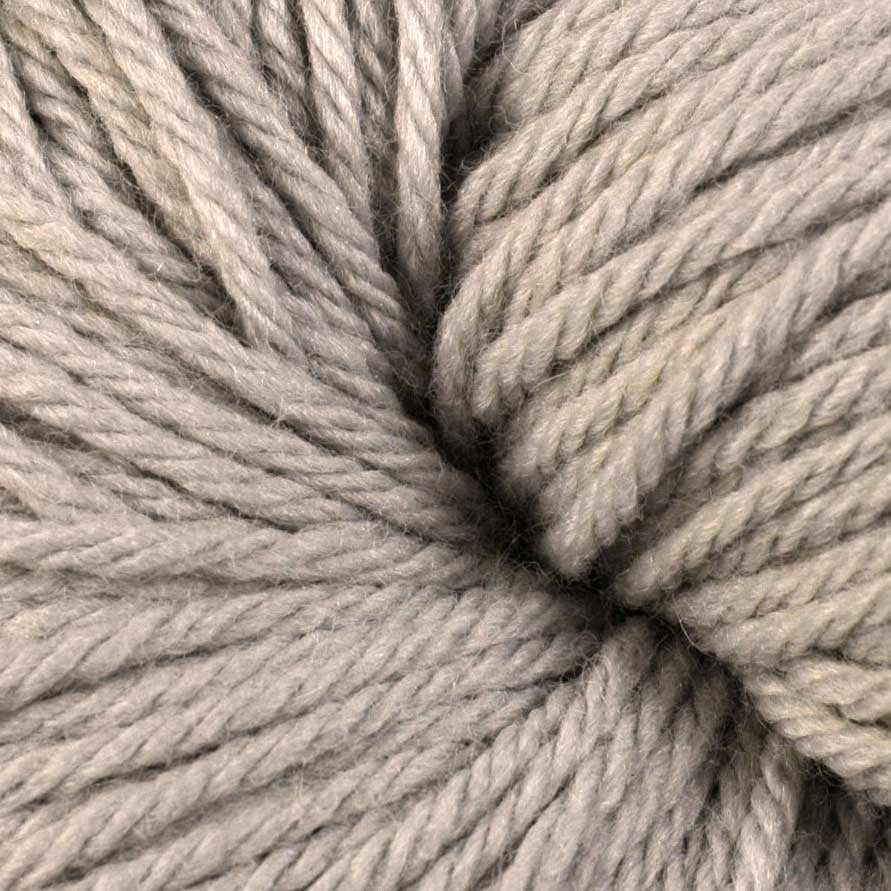 A close up of a skein of Berroco Vintage worsted weight yarn in light beige color