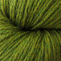 A close up of a skein of Berroco Vintage worsted weight yarn in mustard green color