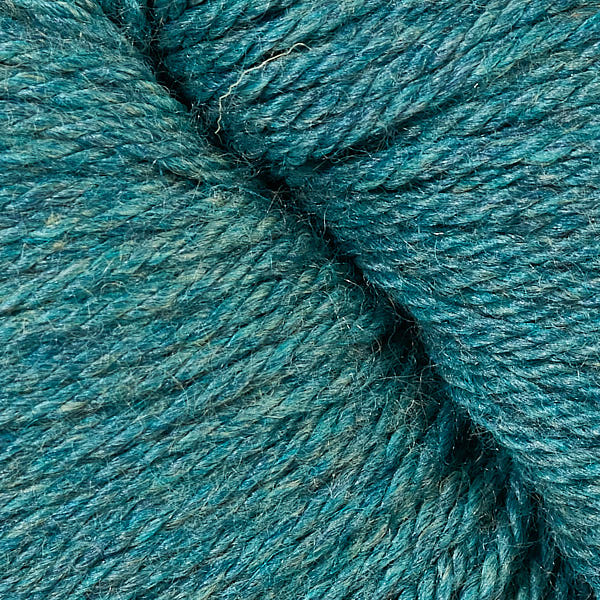 A close up of a skein of Berroco Vintage worsted weight yarn in dusty teal color