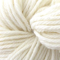 A close up of a skein of Berroco Vintage worsted weight yarn in off white color