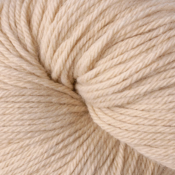 A close up of a skein of Berroco Vintage worsted weight yarn in beige color