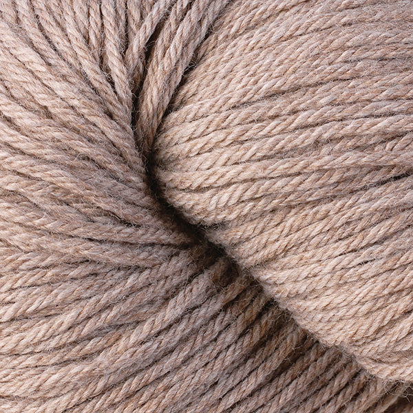A close up of a skein of Berroco Vintage worsted weight yarn in beige color