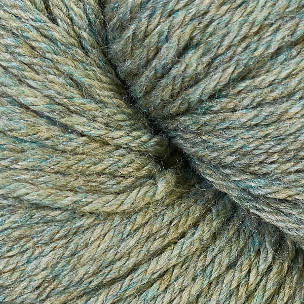 A close up of a skein of Berroco Vintage worsted weight yarn in pale green color