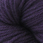 A close up of a skein of Berroco Vintage worsted weight yarn in dark indigo purple color