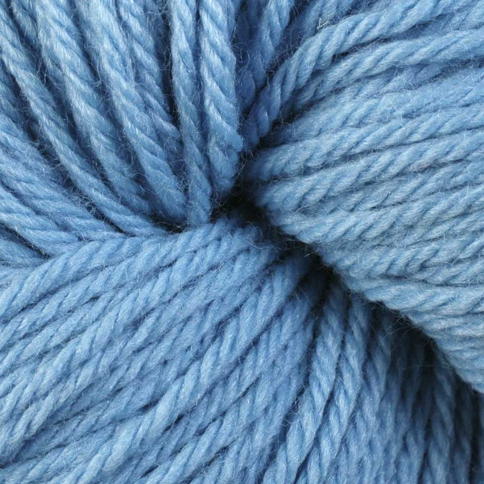 A close up of a skein of Berroco Vintage worsted weight yarn in light blue color