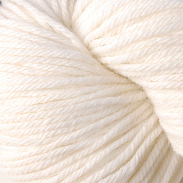 A close up of a skein of Berroco Vintage worsted weight yarn in off white color