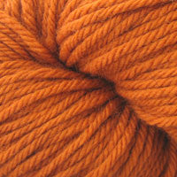 A close up of a skein of Berroco Vintage worsted weight yarn in orange color