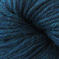 A close up of a skein of Berroco Vintage worsted weight yarn in deep dusty blue color