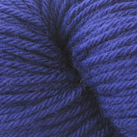 A close up of a skein of Berroco Vintage worsted weight yarn in deep blue color