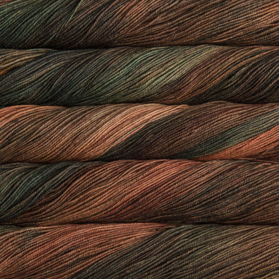 A close-up image of skeins of Malabrigo Sock yarn in shades of brown, green, and orange.