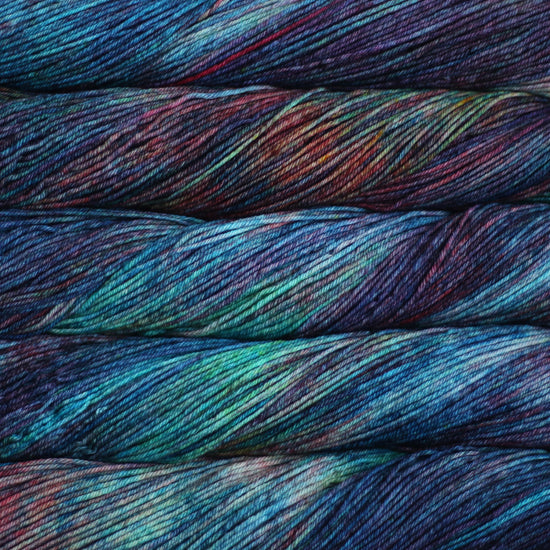 A close-up image of skeins of Malabrigo Sock yarn in shades of blue, green, purple, and red.