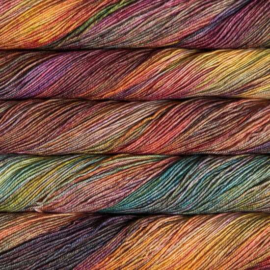 A close-up image of skeins of Malabrigo Sock yarn in shades of orange, teal, and purple.