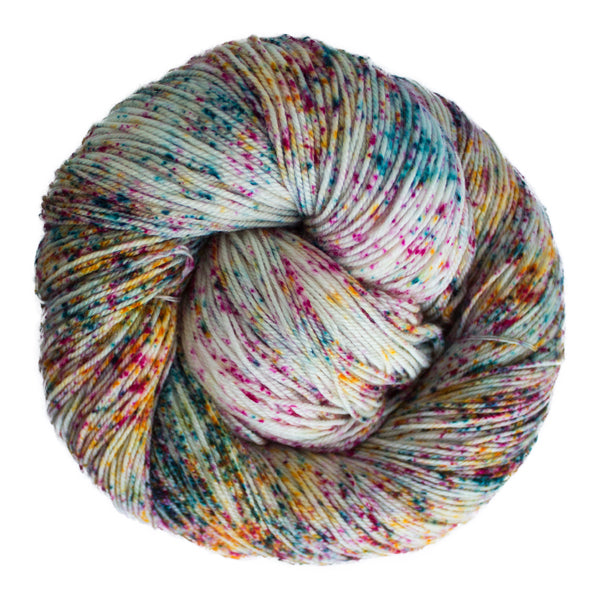 A close-up image of a skein of Malabrigo Sock yarn in a white base with speckles of orange, pink and teal.