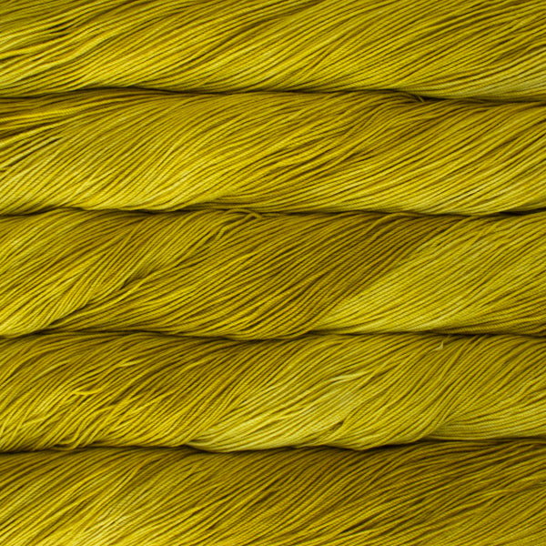 A close-up image of skeins of Malabrigo Sock yarn in bright yellow.
