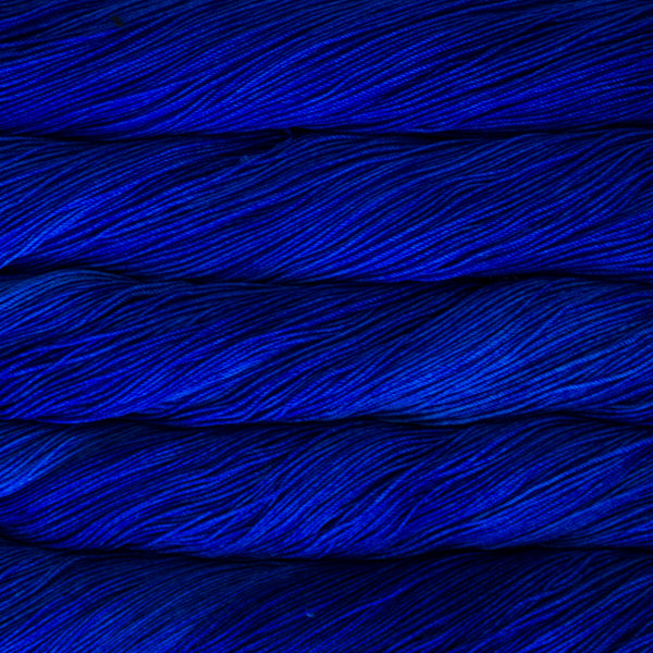 A close-up image of skeins of Malabrigo Sock yarn in a vibrant blue.