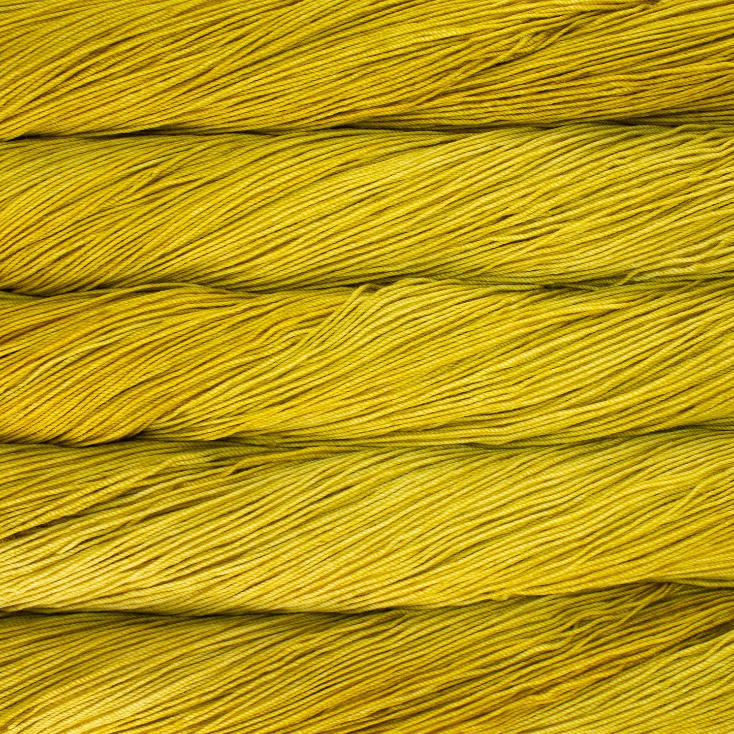 A close-up image of skeins of Malabrigo Sock yarn in shades of yellow.