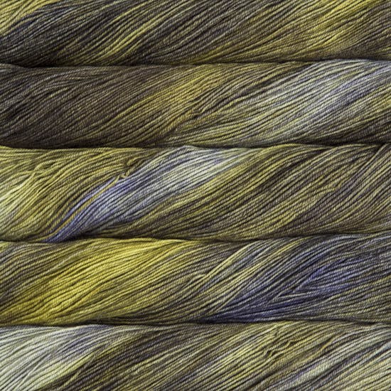 A close-up image of skeins of Malabrigo Sock yarn in shades of green and brown.