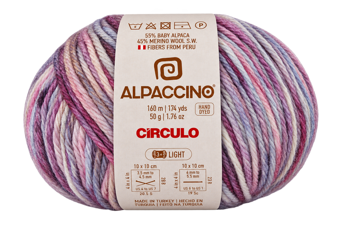 A single ball of Alpacchino Circulo yarn with a cream-colored paper label, featuring variegated colors of pink, purple, blue, and white.