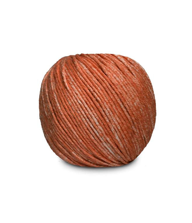 An image of a ball of Circulo Jeans DK weight yarn in orange shades against a white background.
