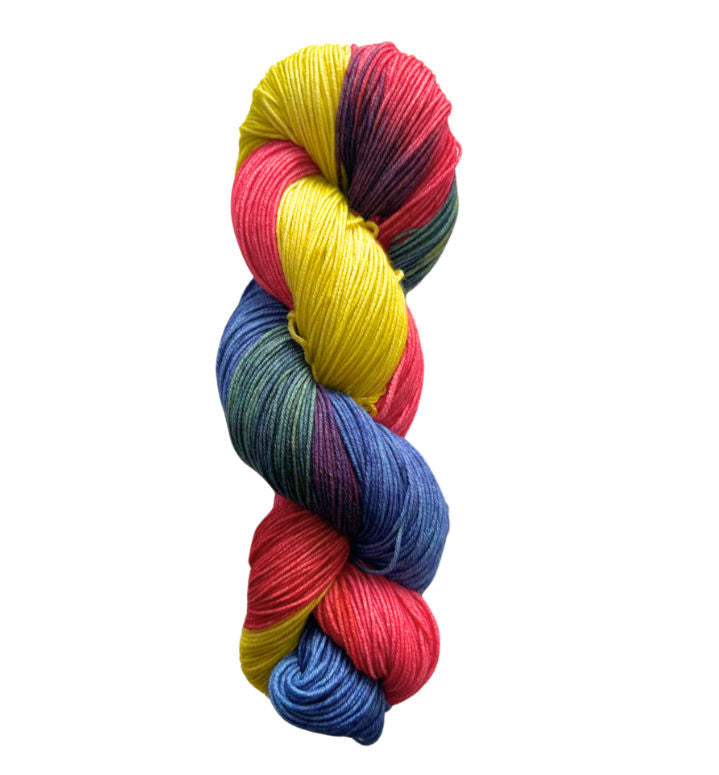 A close-up image of a skein of Circulo Lucky Feet sport weight yarn in blue, bright yellow, hot pink, and purple colors.