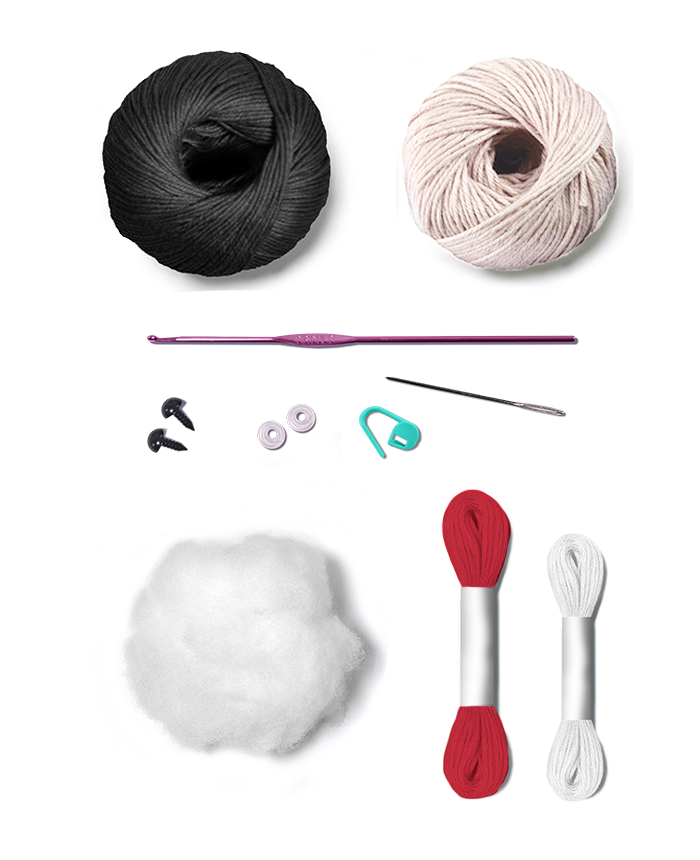 A flat lay of crochet hooking supplies on a white background, including a black ball of yarn, a cream ball of yarn, a purple crochet hook, black and white eyelets, a turquoise stitch marker, a metal needle, white and red cord, and a ball of polyfill stuffing.