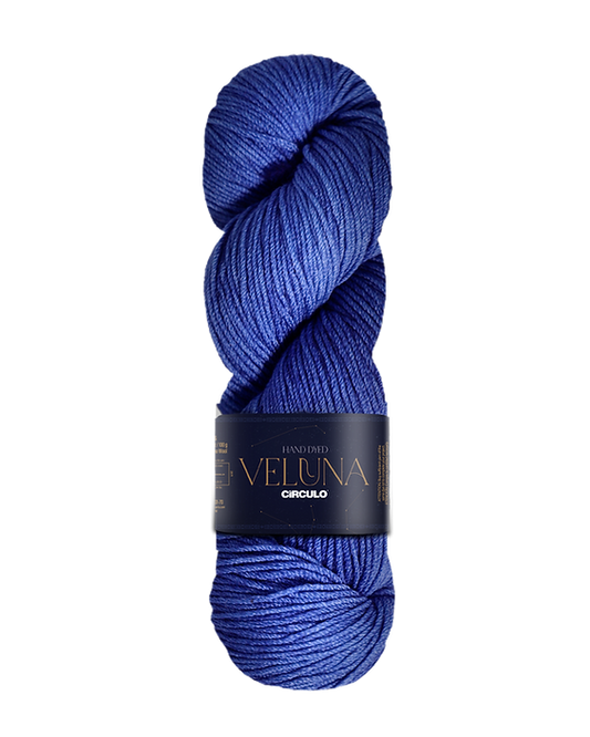 Blue skein of yarn with a dark label on a white background