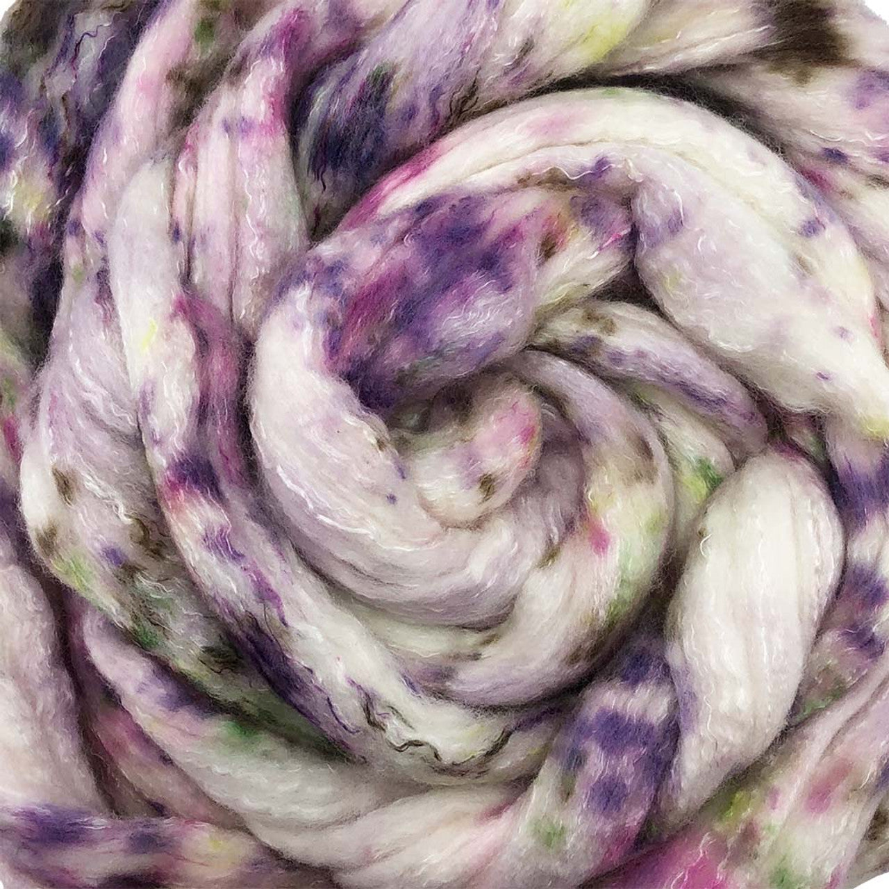 A close up of Frabjous Fibers BFL Spinning Fiber in white, purple, green, and brown colors