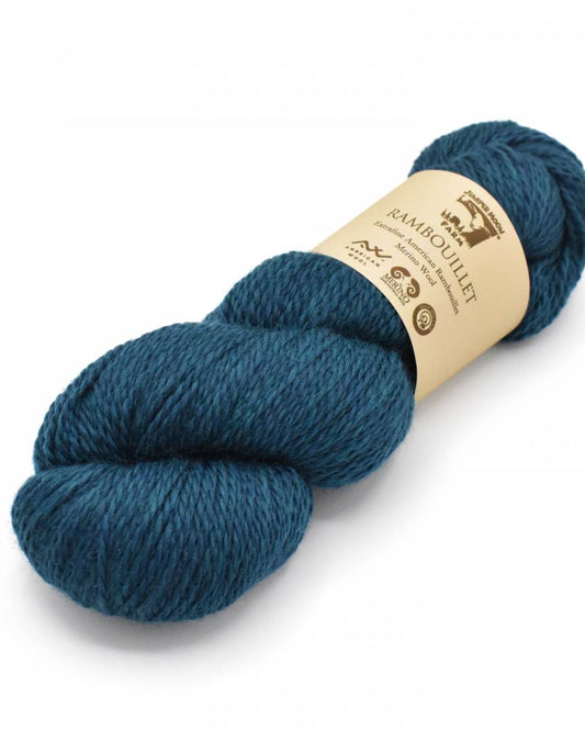 Blue skein of yarn with a label on a white background