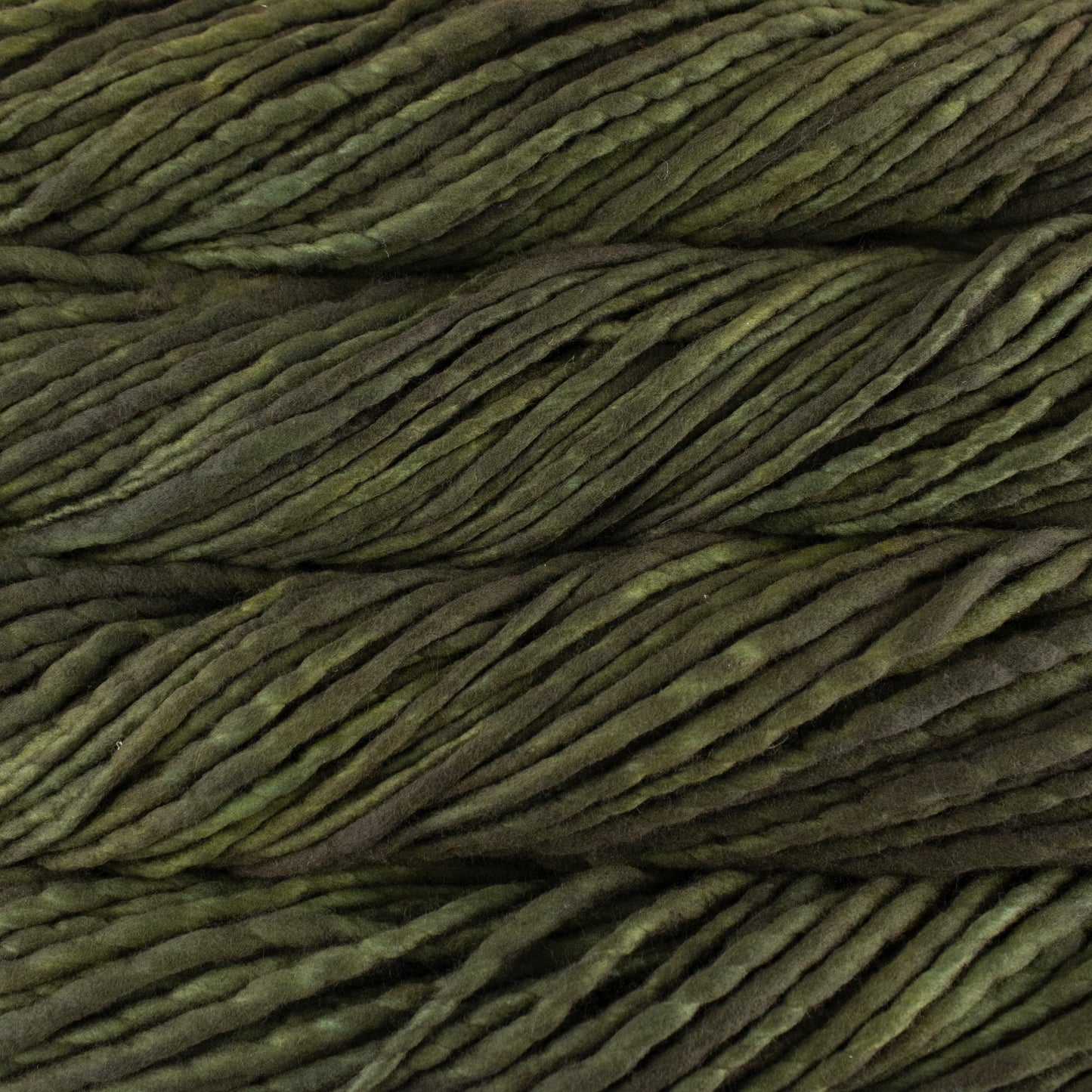 A close-up image of skeins of Malabrigo Rasta yarn in shades of olive green displaying the texture and color variation.