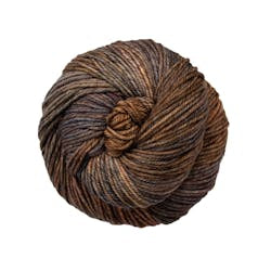 A close up of a skein of Malabrigo Rios worsted weight yarn in brown colors