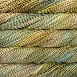 A close up of skeins of Malabrigo Rios worsted weight yarn in yellow and teal colors