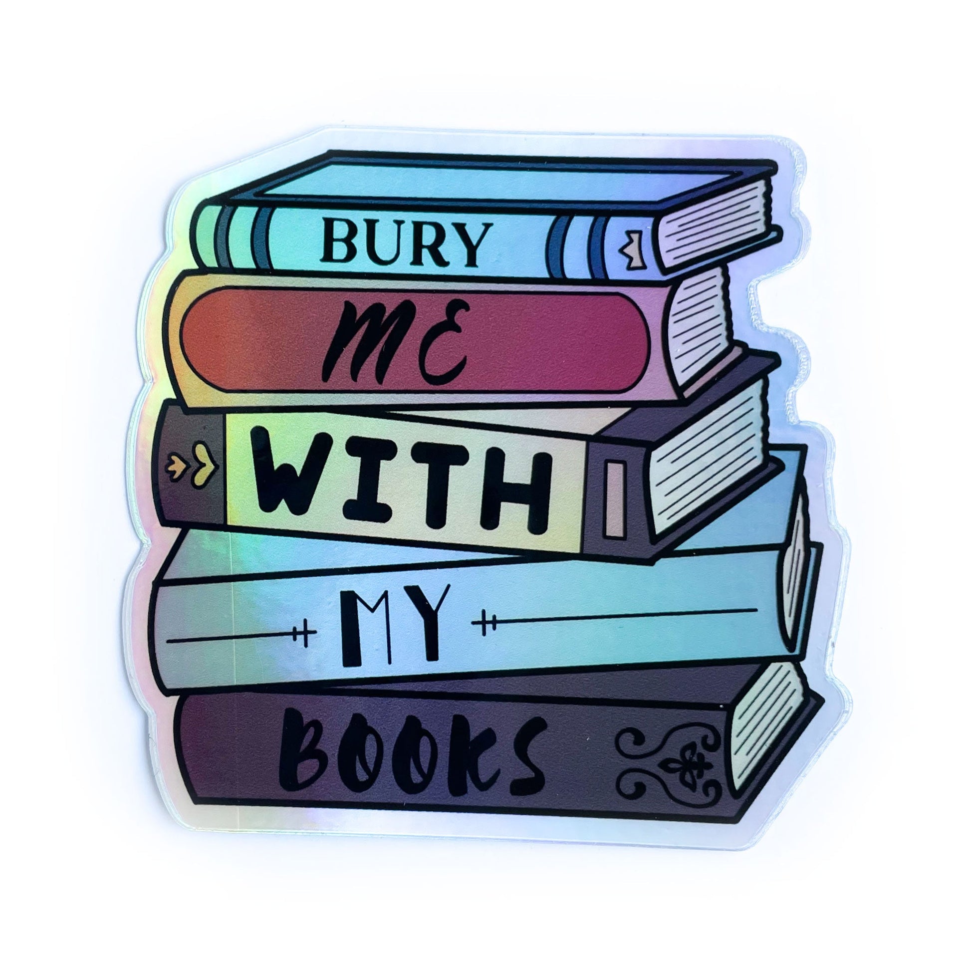 A sticker shaped like a stack of books that reads "Bury me with my books" 