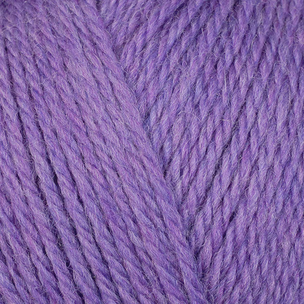 A close-up image of a skein of Berroco Ultra Wool DK weight yarn in a heathered light purple color.