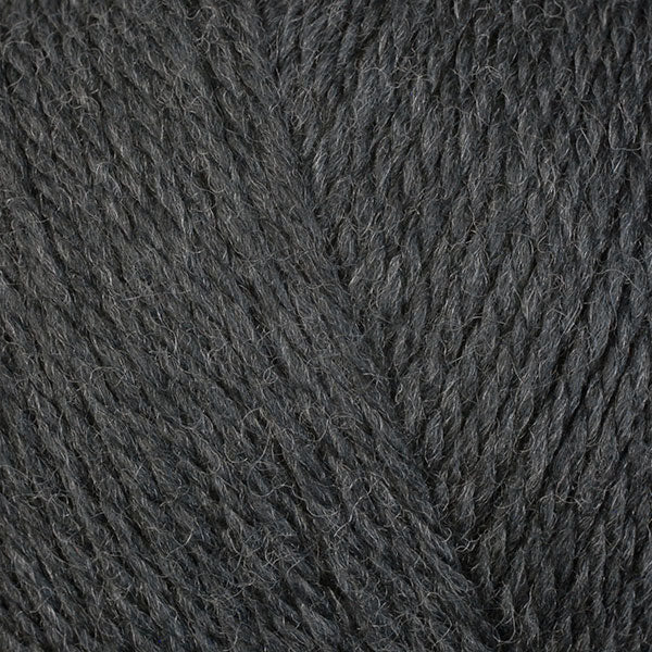 A close-up image of a skein of Berroco Ultra Wool DK weight yarn in a charcoal gray color.