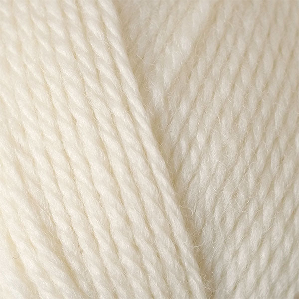 A close-up image of a skein of Berroco Ultra Wool DK weight yarn in a solid cream color.