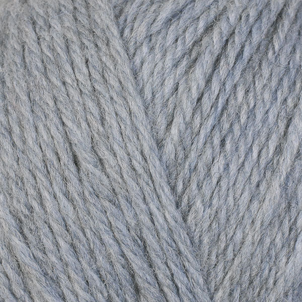 A close-up image of a skein of Berroco Ultra Wool DK weight yarn in a heathered light gray color.