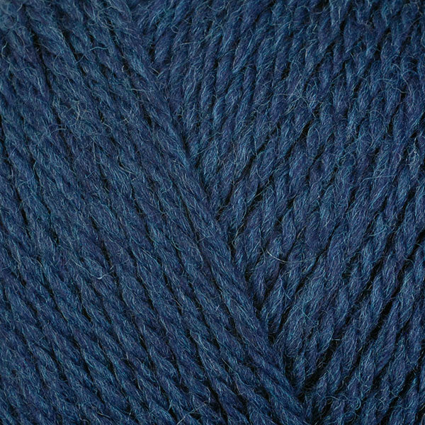 A close-up image of a skein of Berroco Ultra Wool DK weight yarn in a heathered navy blue color.