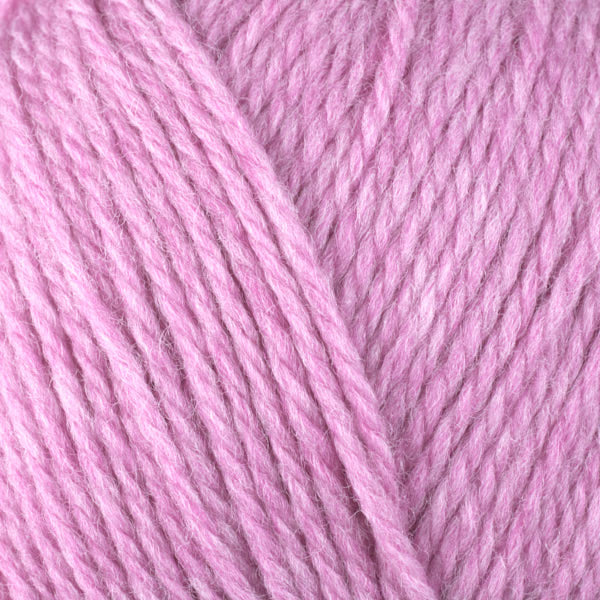 A close-up image of a skein of Berroco Ultra Wool DK weight yarn in a heathered light pink color.
