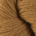 A close up of a skein of Berroco Vintage worsted weight yarn in light brown color