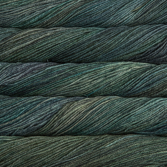 An image of skeins of Malabrigo Arroyo sport weight yarn in muted green and teal shades.