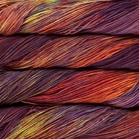 An image of skeins of Malabrigo Arroyo sport weight yarn in shades of orange, purple, and yellow.